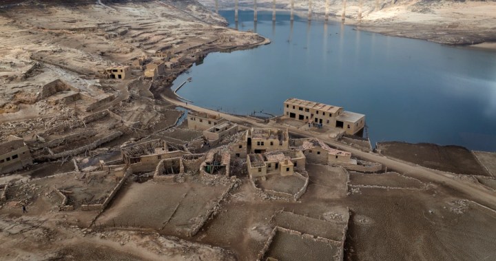 Incredible photos show Spanish ghost village emerge after 30 years underwater