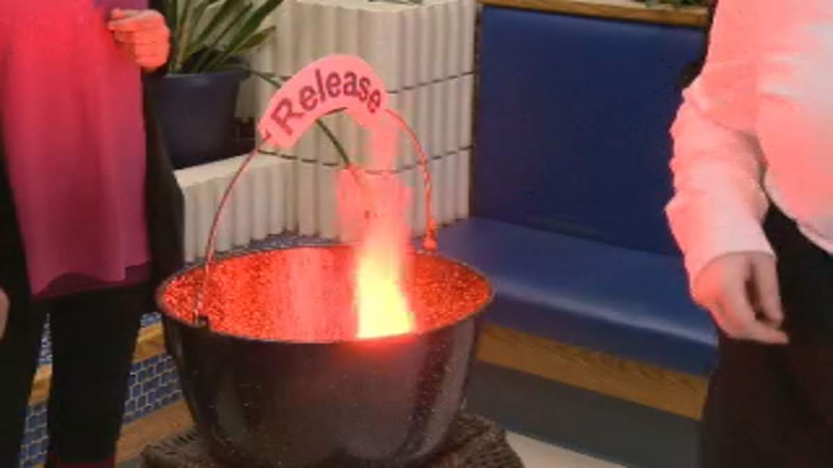 BJM Pink Shirt Day. Burning a piece of paper with something that's weighing them down. 