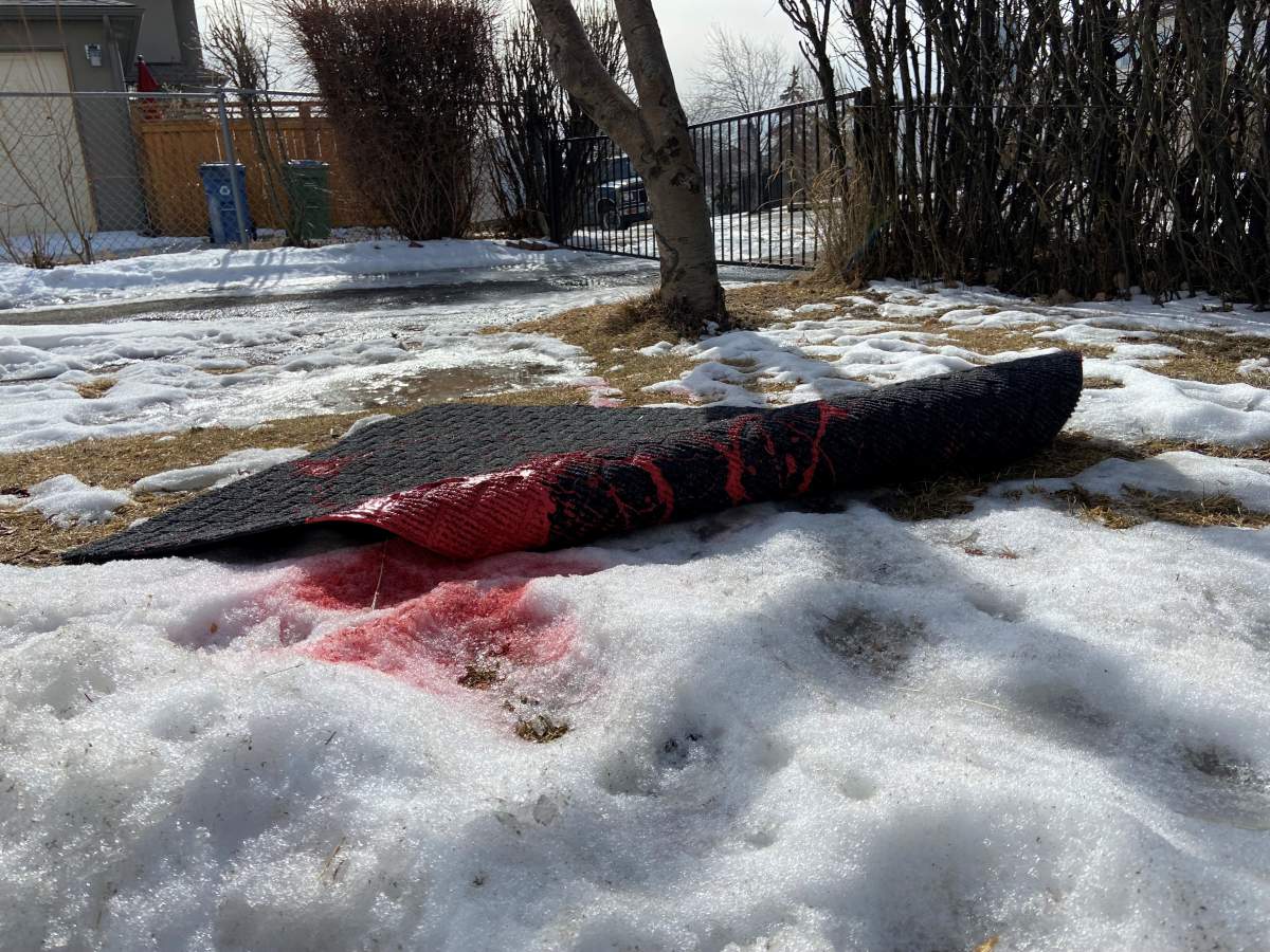 Red stained carpet outside church.