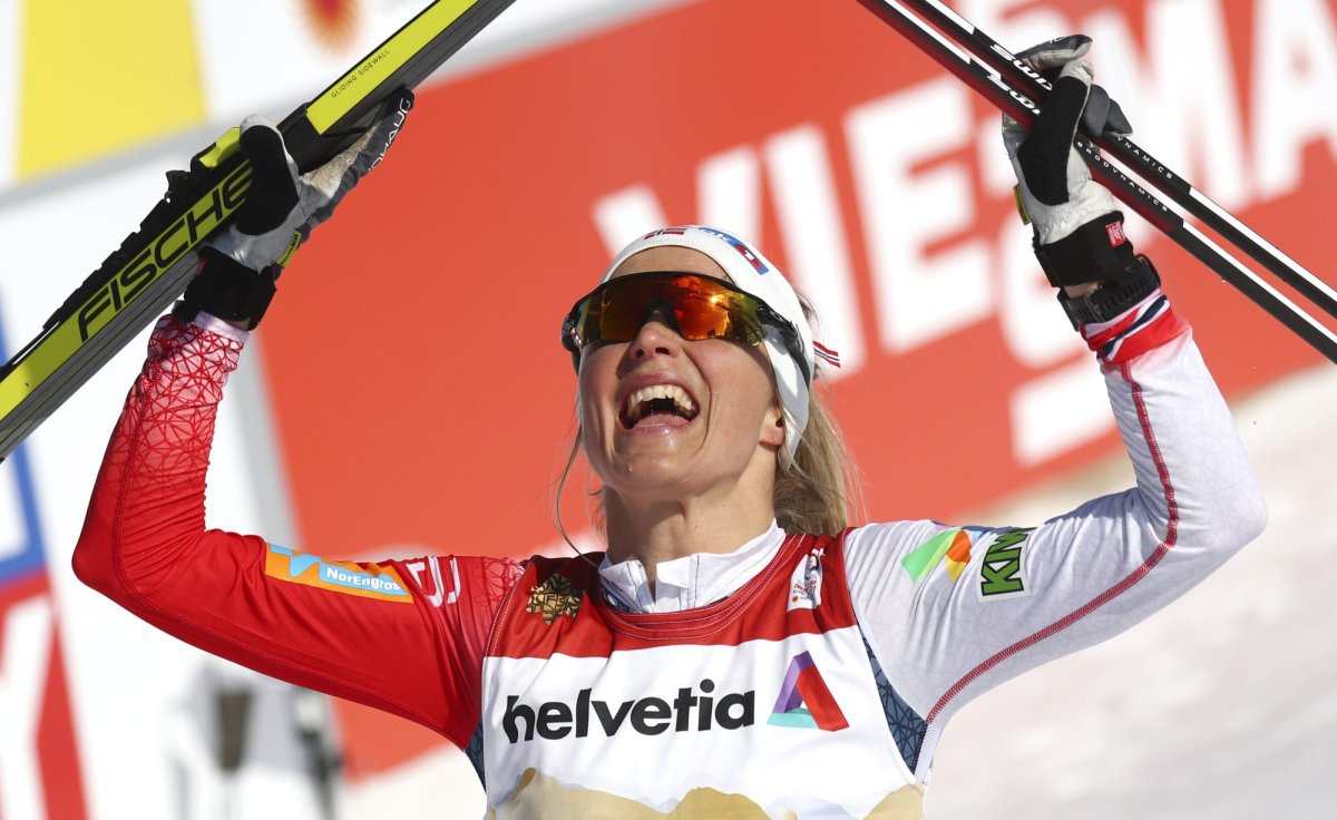 Norway's Therese Johaug reacts after crossing the finish line during the WSC Women's Mass Start 30km Classic cross country event at the FIS Nordic World Ski Championships in Oberstdorf, Germany, Saturday, March 6, 2021. (AP Photo/Matthias Schrader).