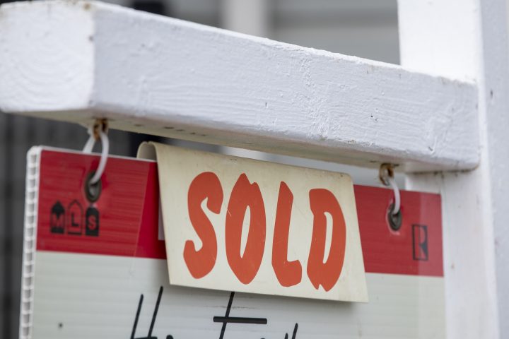 A property with a sold real estate sign on it in Kingston, Ont., on Wednesday June 9, 2021.