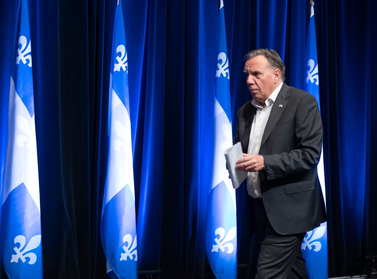 Quebec Premier Francois Legault walks out of a news conference at the end of a three-day pre-session caucus, Friday, September 10, 2021  in Quebec City.  