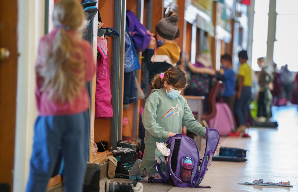 Students in an elementary school get ready for class.