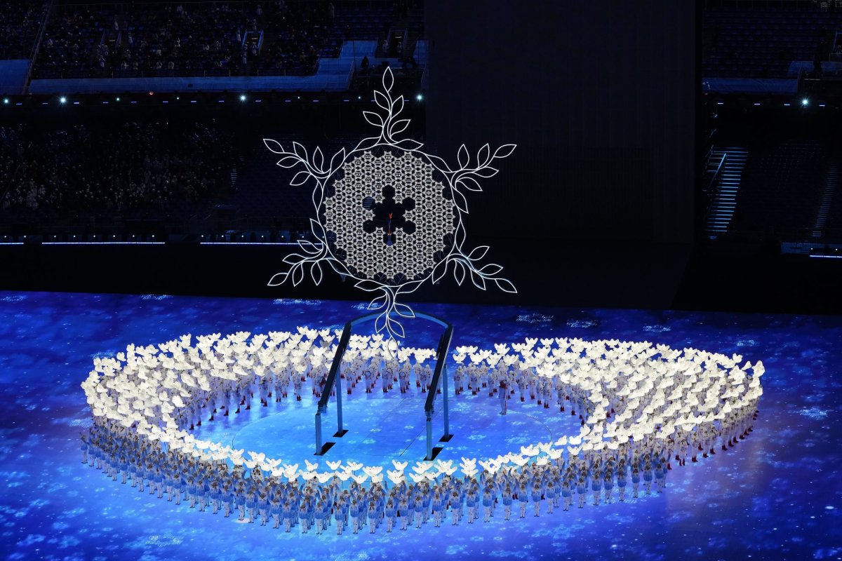 The Olympic cauldron is framed in a snowflake during the opening ceremonies for the 2022 Olympic Winter Games in Beijing, Friday, Feb. 4, 2022. THE CANADIAN PRESS/Paul Chiasson.