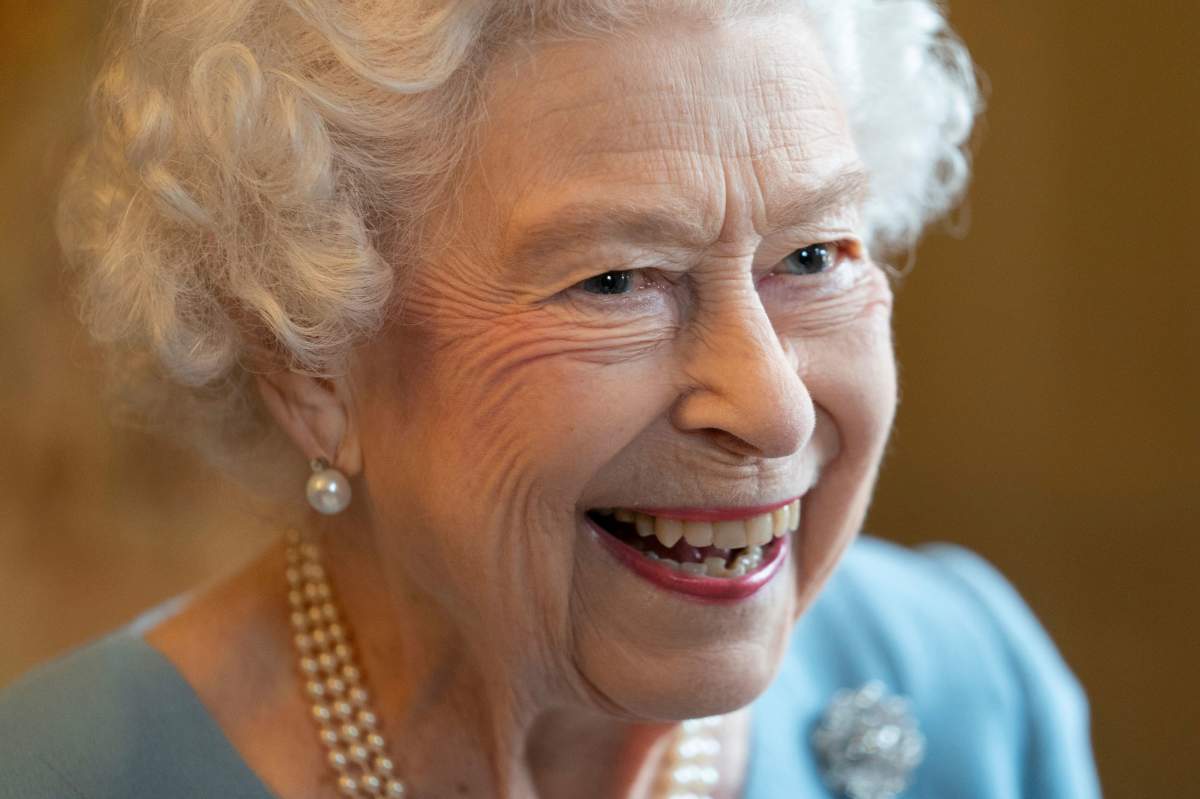 Britain's Queen Elizabeth II smiles during a reception to celebrate the start of the Platinum Jubilee, at Sandringham House, her Norfolk residence, in Sandringham, England, Saturday, Feb. 5, 2022.
