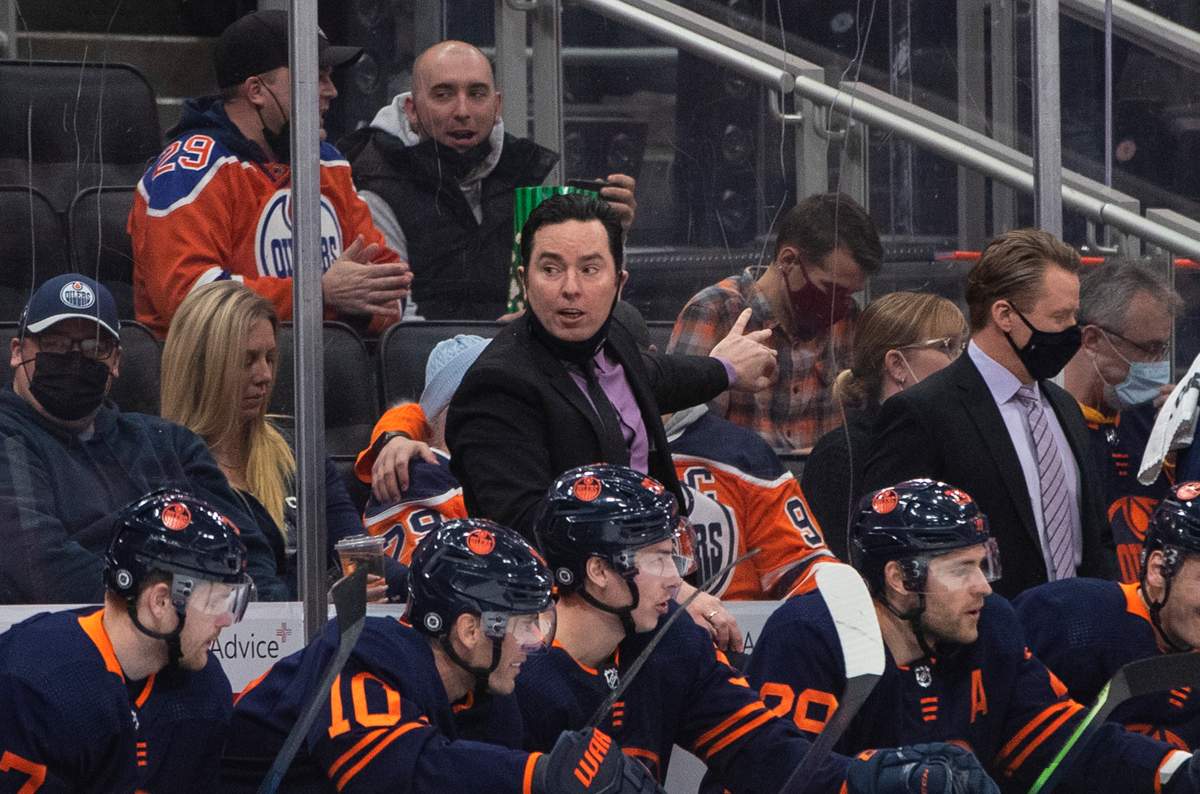 Edmonton Oilers interim head coach Jay Woodcroft coaches players against the New York Islanders during first period NHL action in Edmonton on Friday, February 11, 2022.THE CANADIAN PRESS/Jason Franson