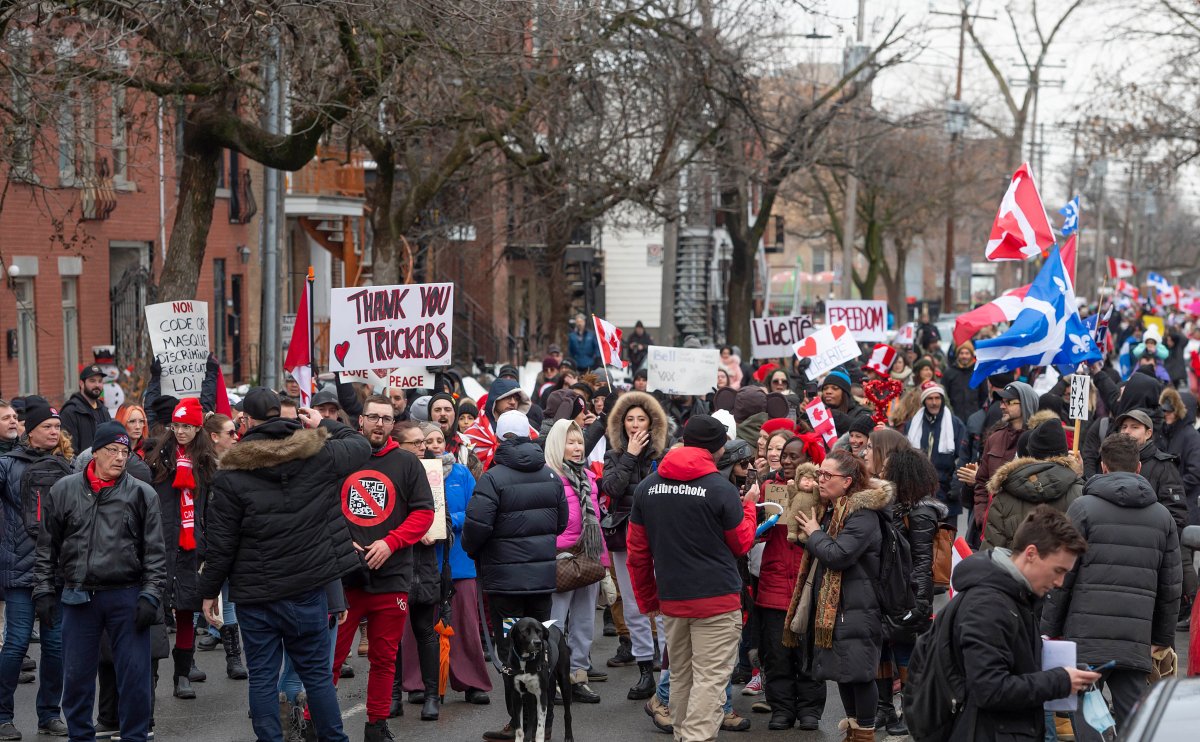 Protesters against COVID-19 restrictions march through the streets of Montreal on Saturday, February 12, 2022.
