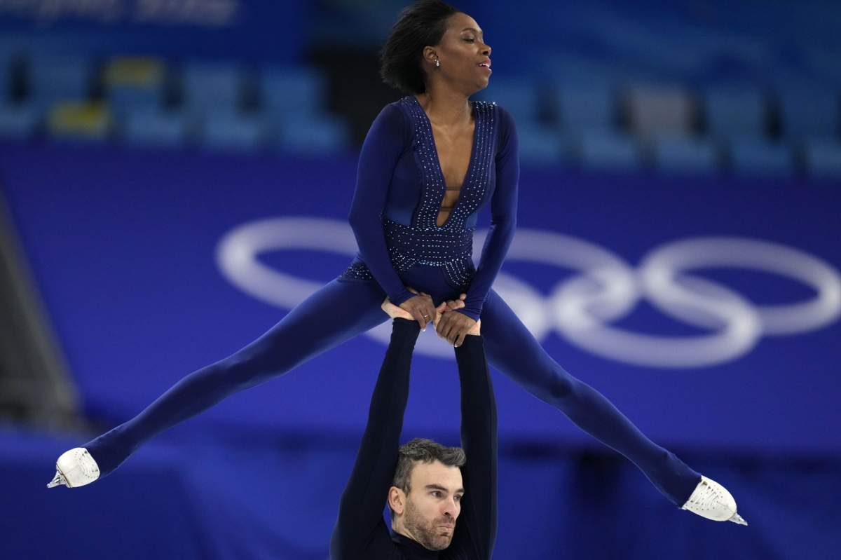 Vanessa James and Eric Radford, of Canada, compete in the pairs free skate program during the figure skating competition at the 2022 Winter Olympics, Saturday, Feb. 19, 2022, in Beijing. (AP Photo/Natacha Pisarenko)