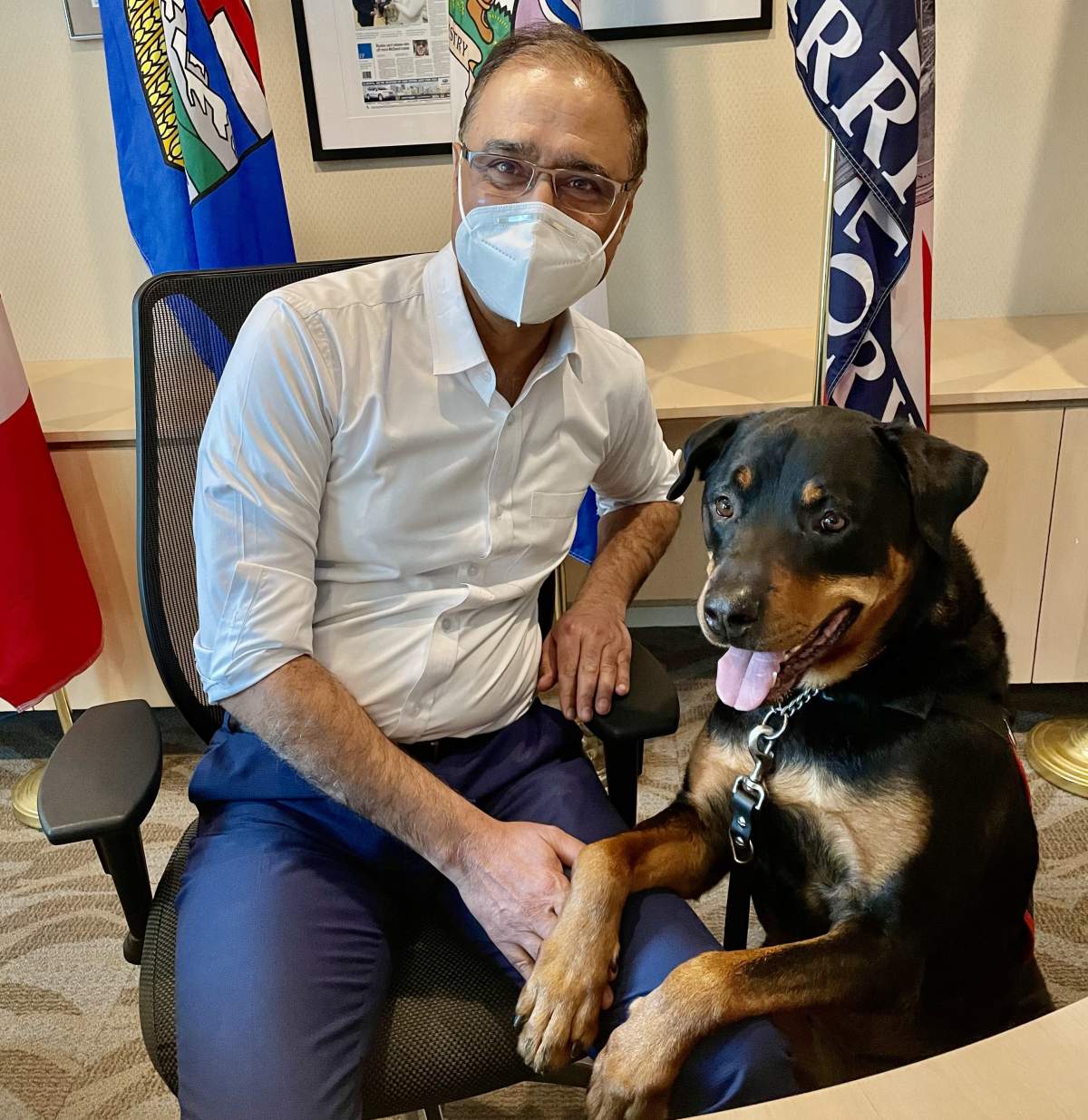 Amarjeet Sohi and Kuno pose for a photo on February 17, 2022