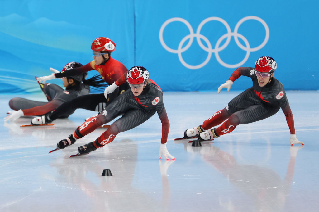 Kim Boutin and Florence Brunelle of Team Canada compete as Kexin Fan of Team China and Alyson Charles of Team Canada crash during the Women's 500m Quarterfinals on day three of the Beijing 2022 Winter Olympic Games at Capital Indoor Stadium on February 07, 2022 in Beijing, China.