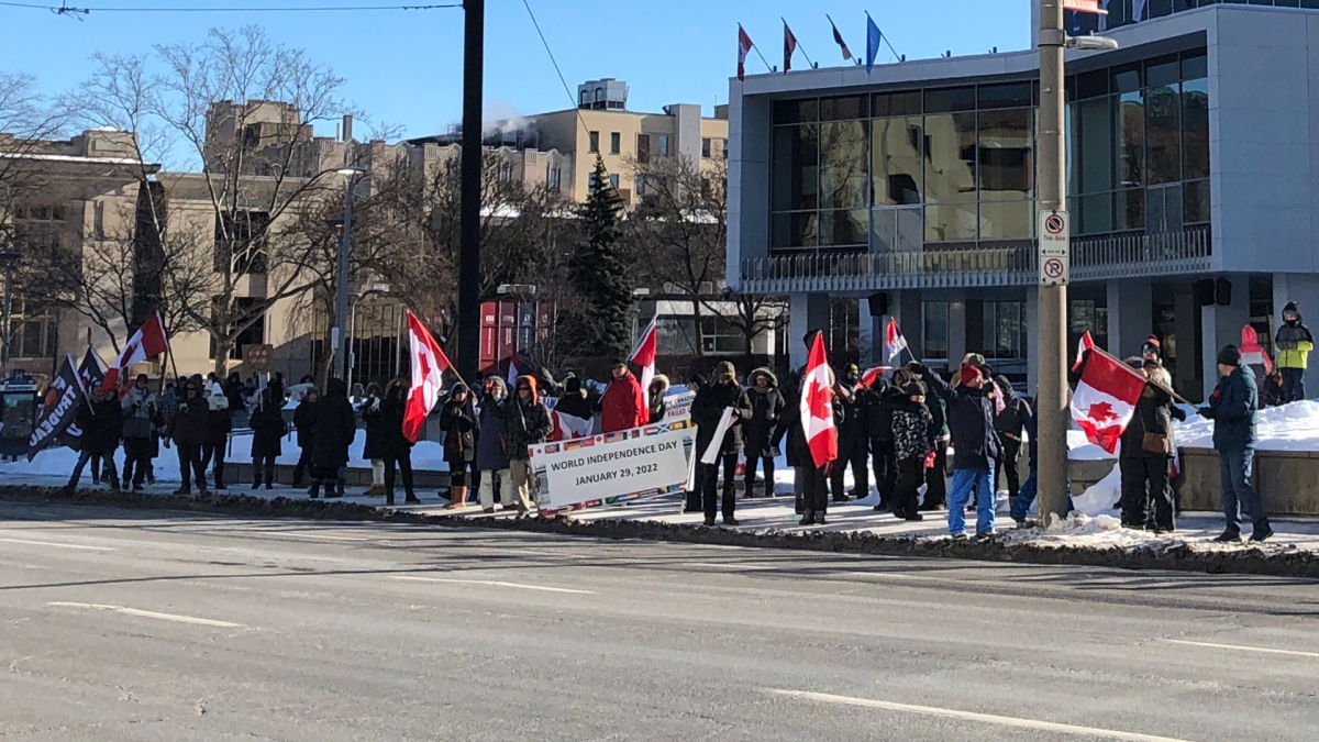 Demonstrators gathered in front of Hamilton city hall.