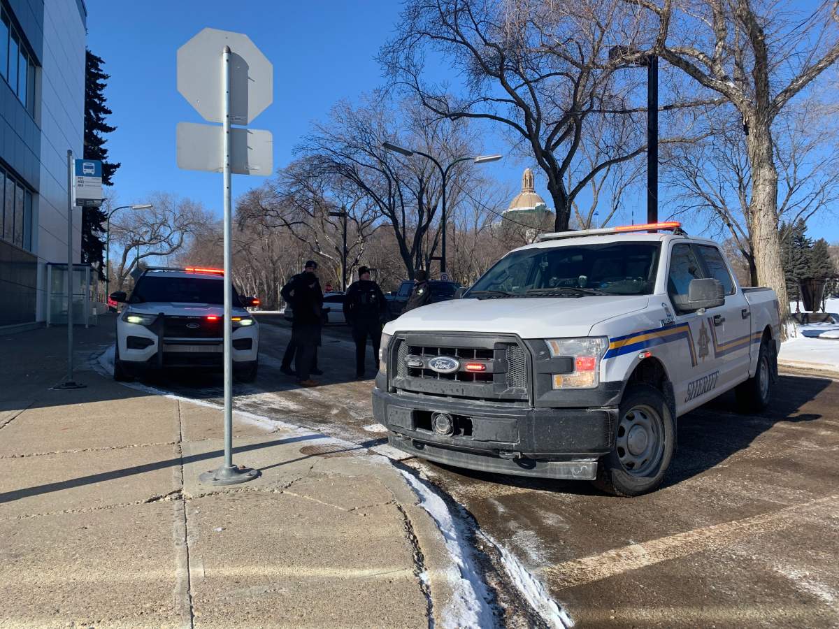 Alberta Sheriffs block off a road near the Alberta legislature grounds on Feb. 22, 2022.