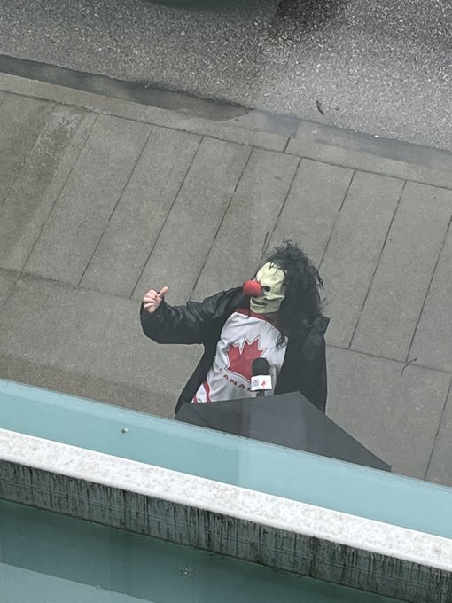 Demonstrators outside a COVID-19 vaccine clinic in New Westminster on Thursday.