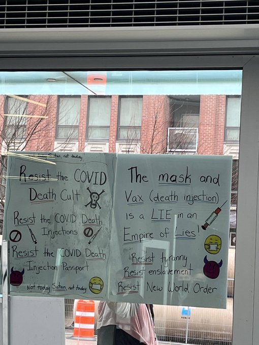 Demonstrators outside a COVID-19 vaccine clinic in New Westminster on Thursday.