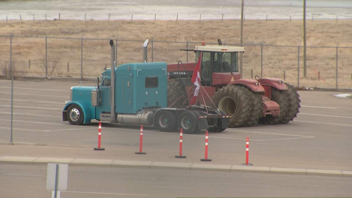 A semi truck and a farm tractor that was seized by RCMP in relation to an investigation at the Coutts, Alta., border crossing.