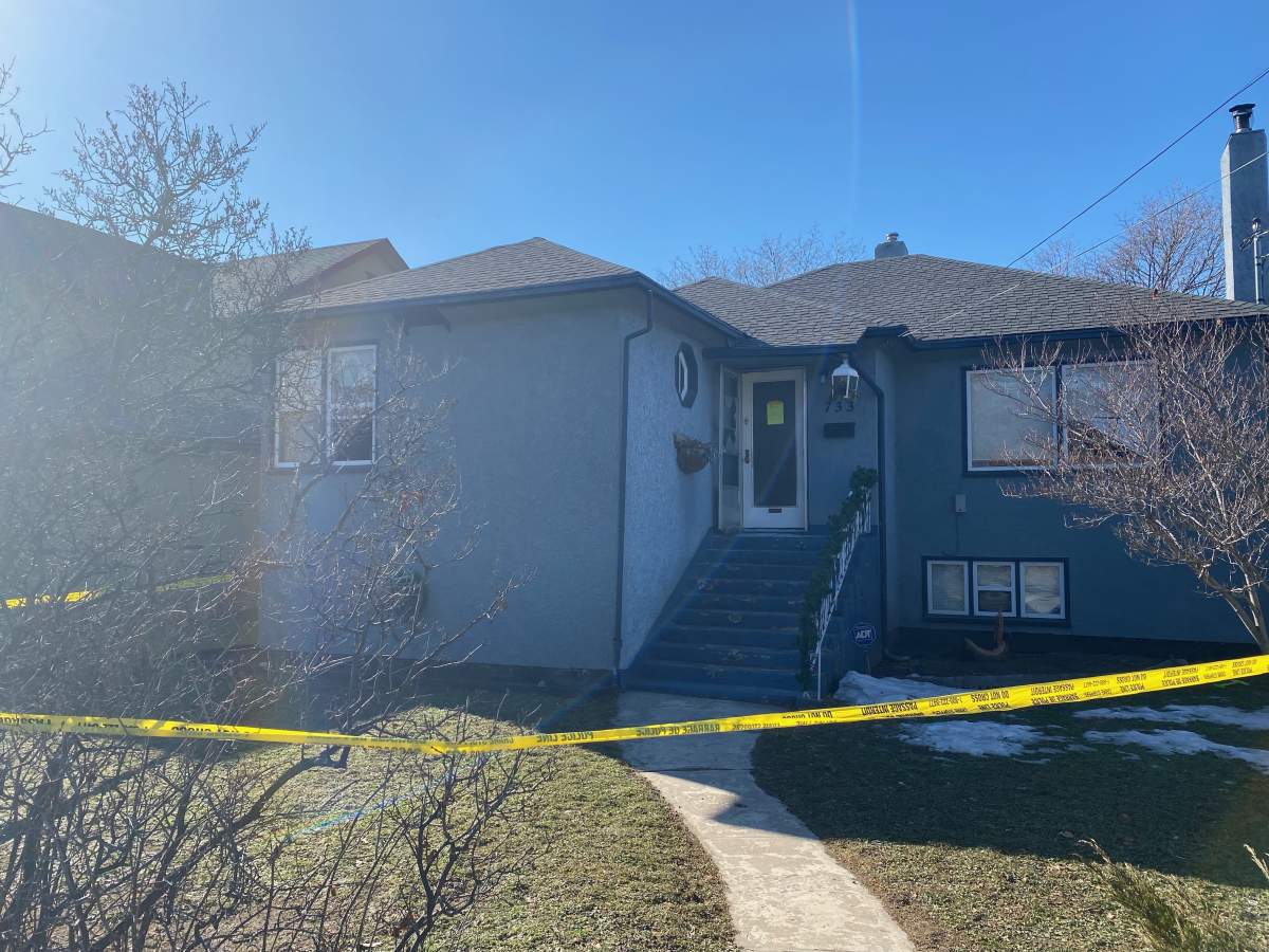 Police tape surrounds a house in Penticton following a standoff on Saturday morning.