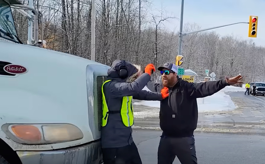 Two men got into a confrontation on Brealey Drive during a slow-roll convoy in Peterborough on Feb. 19, 2022.