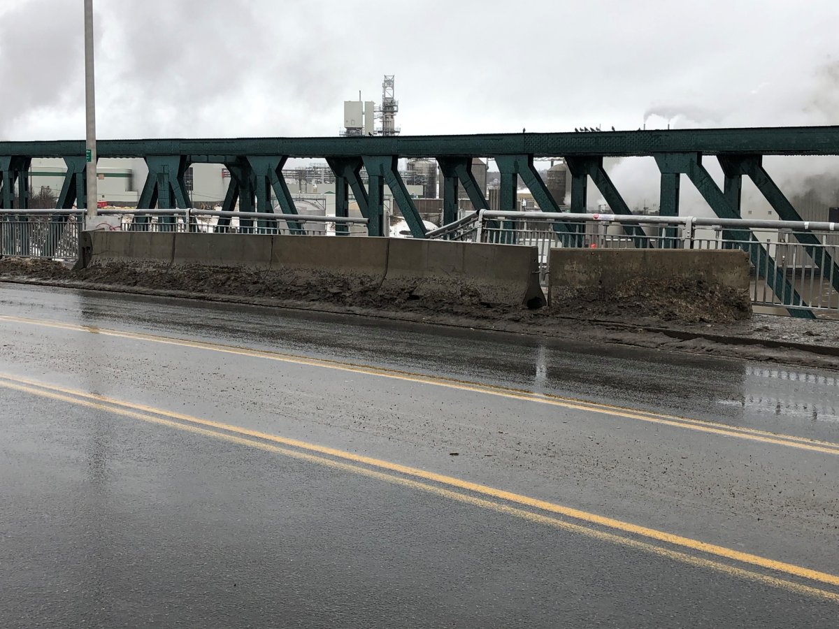 Temporary barriers block damage to a guardrail on Reversing Falls Bridge in Saint John, N.B., on February 3, 2022.