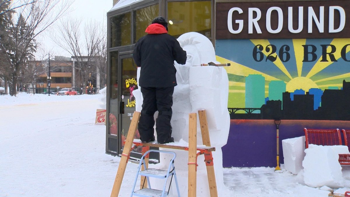 Pro sculptor Theressa Wright working on an eight foot yeti snow monster in Saskatoon.