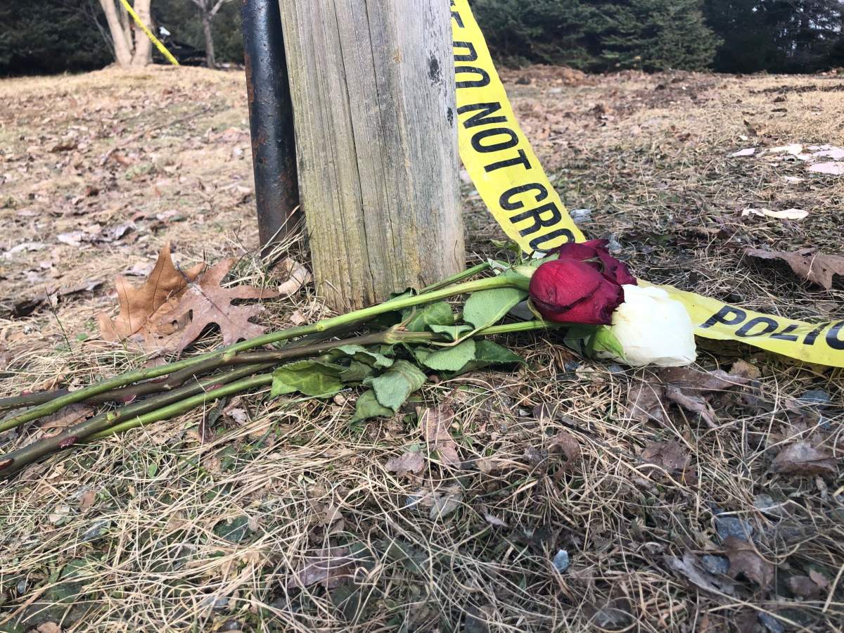 Community members have been leaving flowers at the site of the fatal fire.