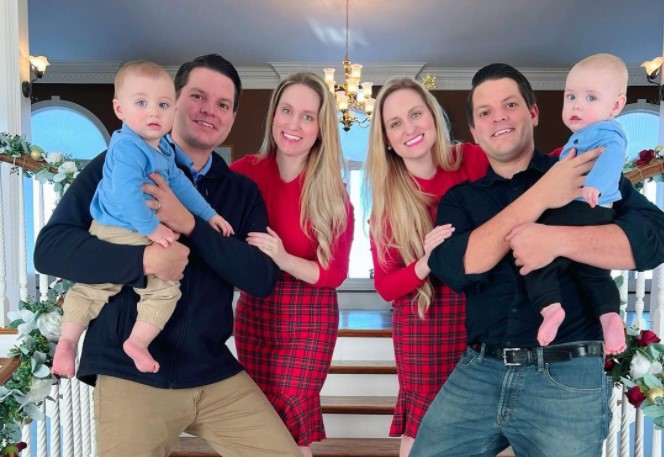 The Salyer twin couples pose with their babies for a Christmas photo.