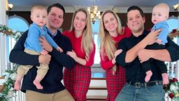 The Salyer twin couples pose with their babies for a Christmas photo.