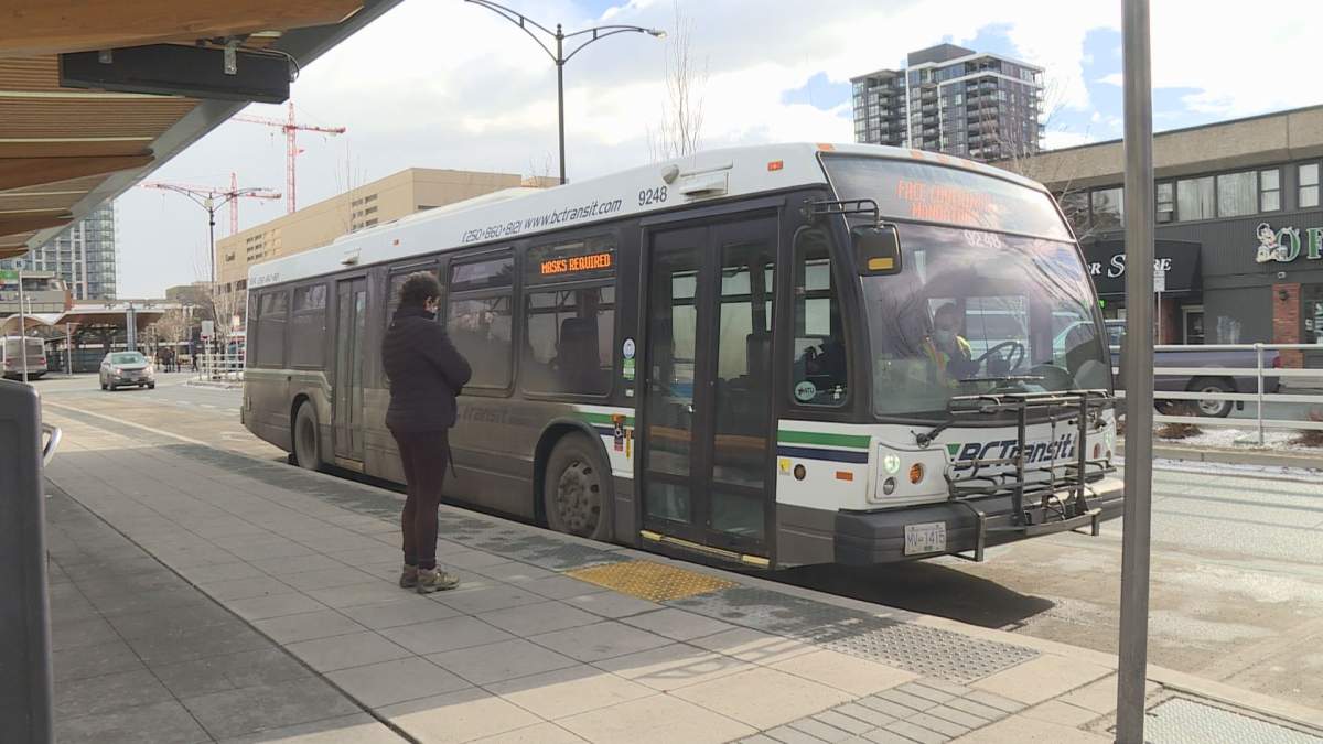 Transit rider waits to get on a bus in Kelowna.