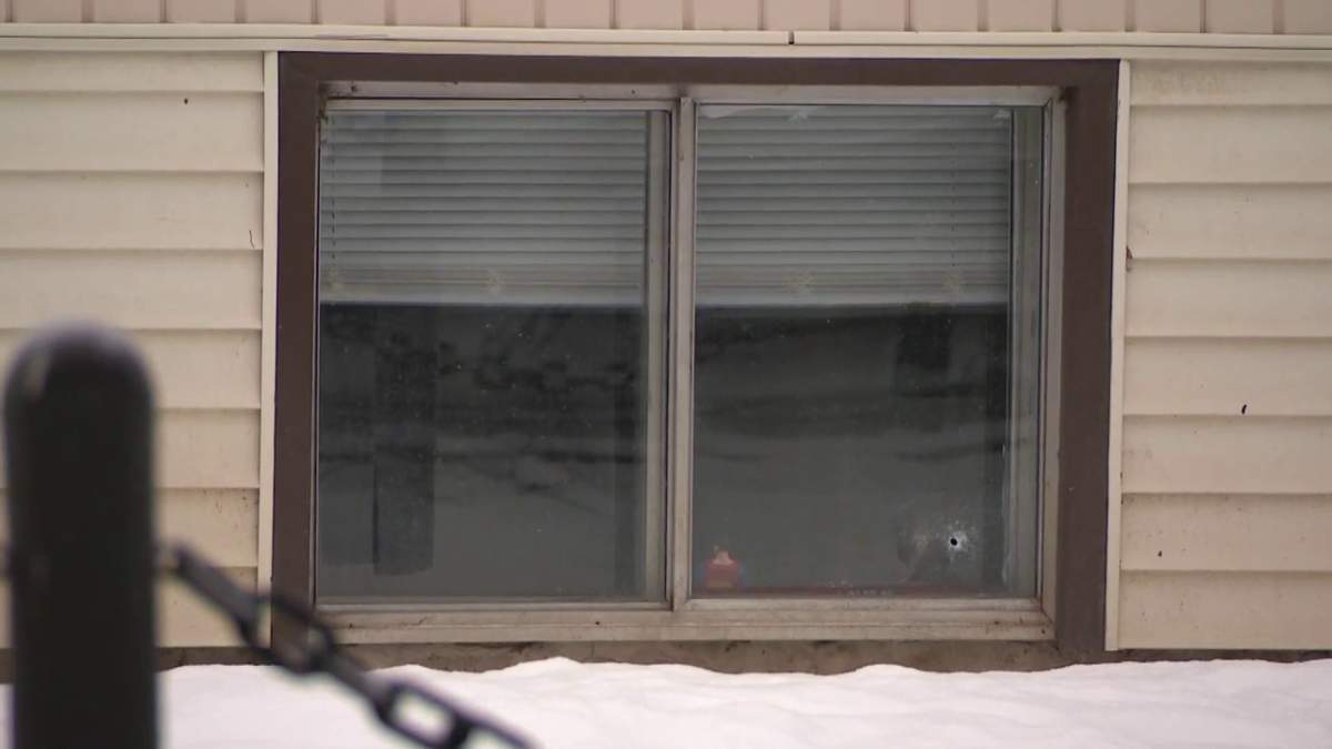 The Metro105 Apartments building at 10724 - 105 St. remained surrounded by police tape Thursday, Feb. 24, 2022 after an officer-involved shooting in the area the night before left one innocent person and one suspect dead.