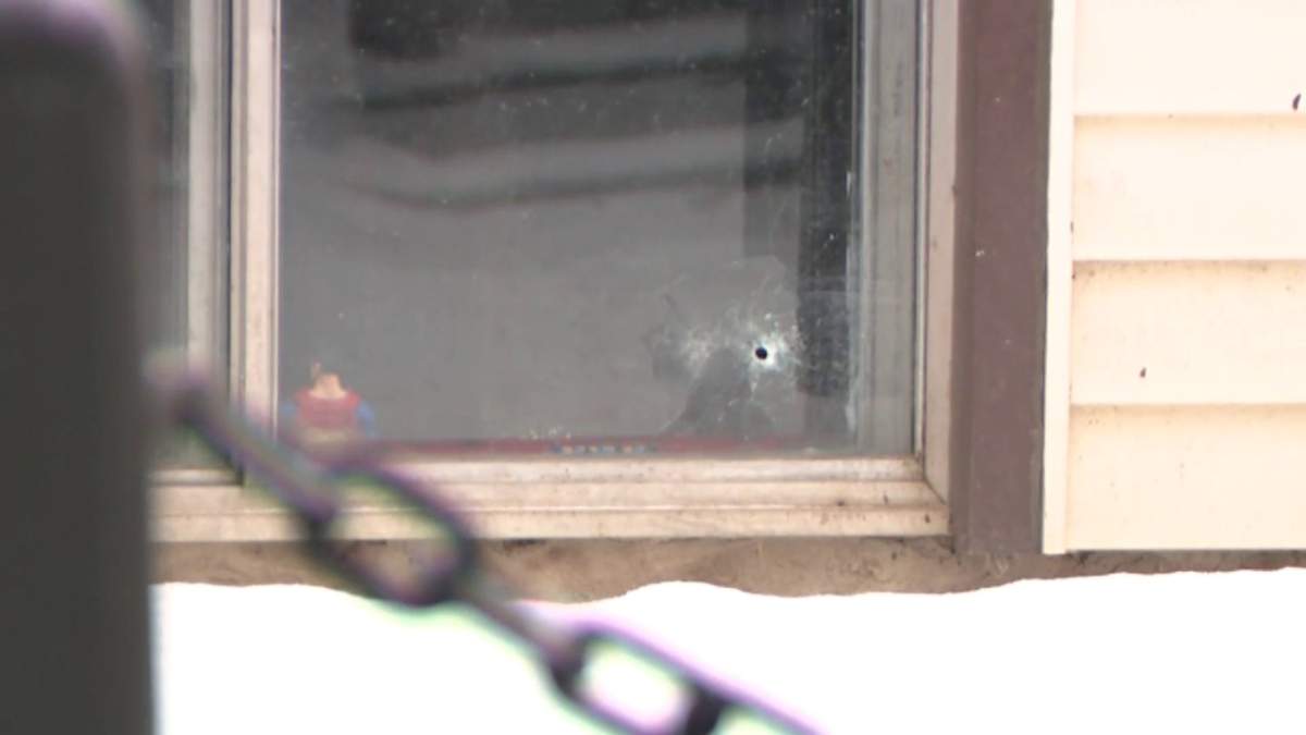 The Metro105 Apartments building at 10724 - 105 St. remained surrounded by police tape Thursday, Feb. 24, 2022 after an officer-involved shooting in the area the night before left one innocent person and one suspect dead.