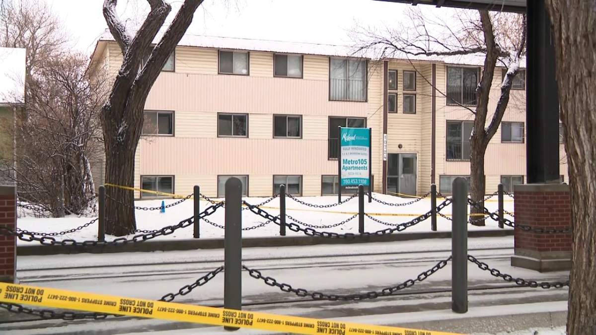 The Metro105 Apartments building at 10724 - 105 St. remained surrounded by police tape Thursday, Feb. 24, 2022 after an officer-involved shooting in the area the night before left one innocent person and one suspect dead.