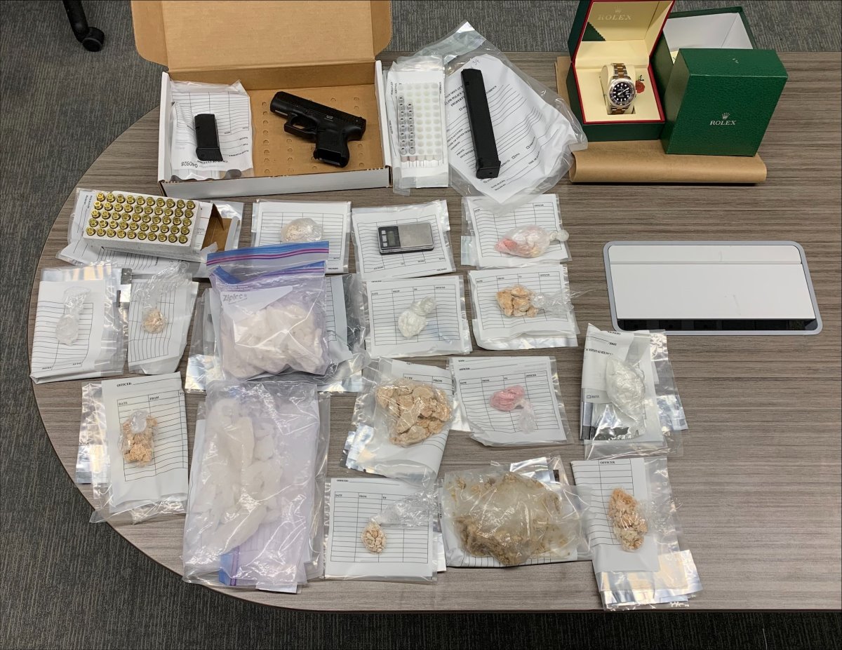 Guelph police say officers carrying out a search warrant in Kitchener seized a gun, ammunition and $50,000 worth of illegal drugs. 