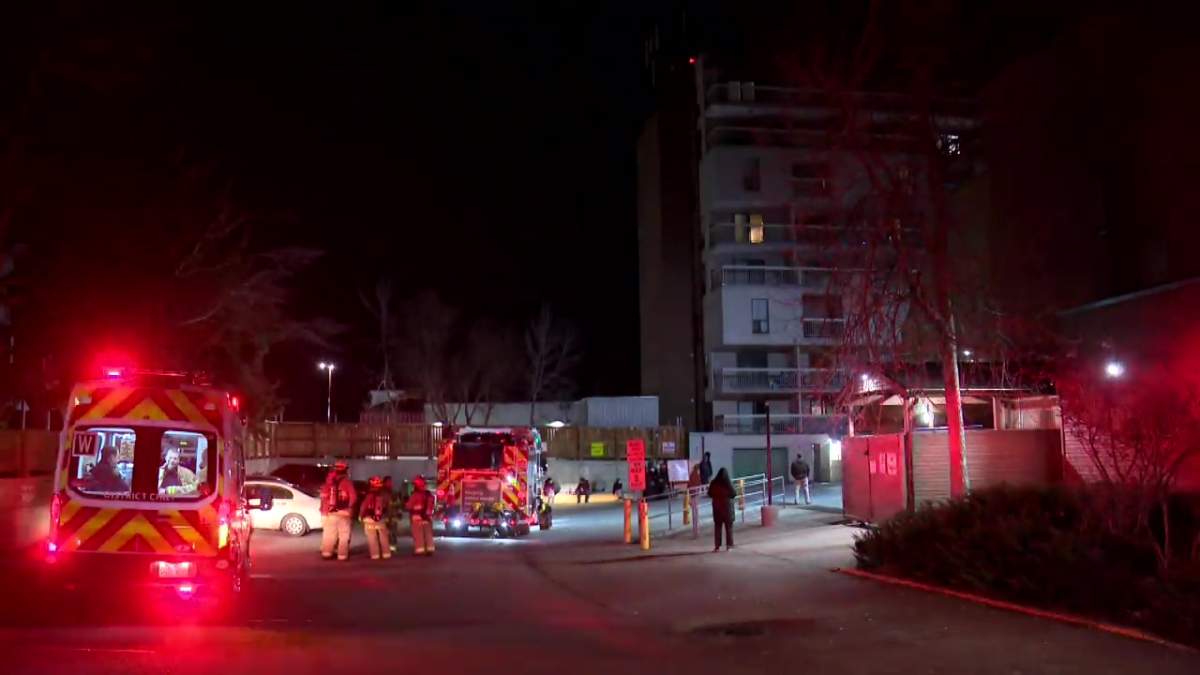 Calgary firefighters on standby at an apartment fire in the Glendale community.