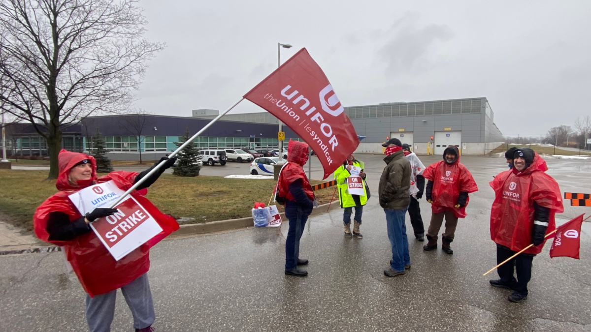 Oakville transit workers form a picket line at the town's bus facility on Wyecroft Road. Staff alerted riders that they'll have to make alternate travel arrangements in light of a work stoppage on Feb. 17, 2022.