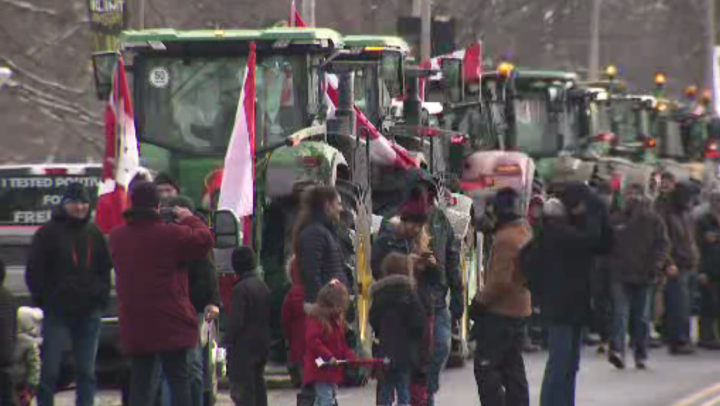 Demonstrators are seen in Toronto on Friday.