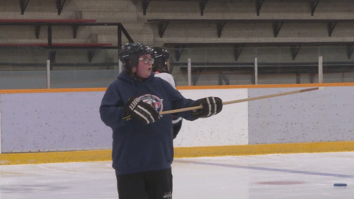Sam Buchanan giving instructions during a ringette practice at Eric Coy arena.