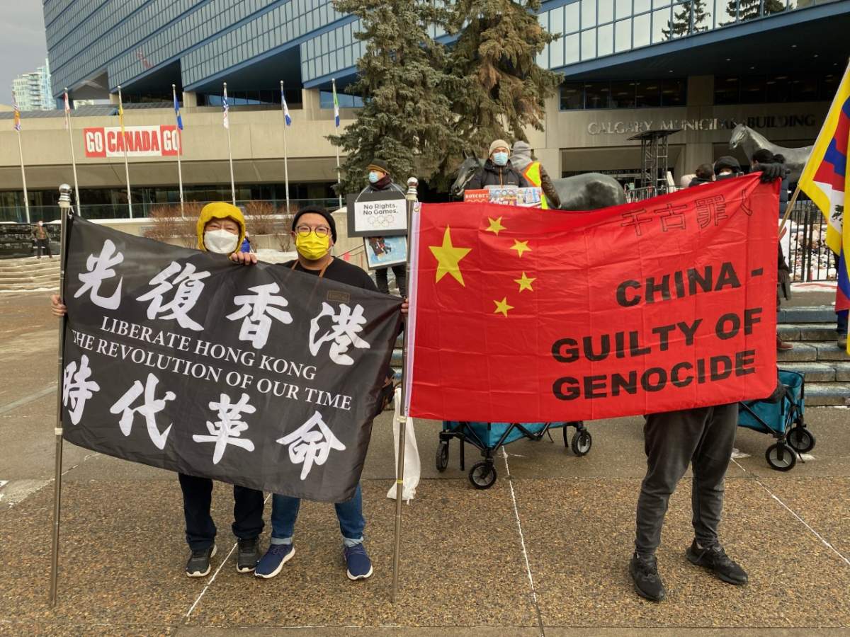 Protesters on the steps of Calgary city hall try to bring attention to China's human rights record