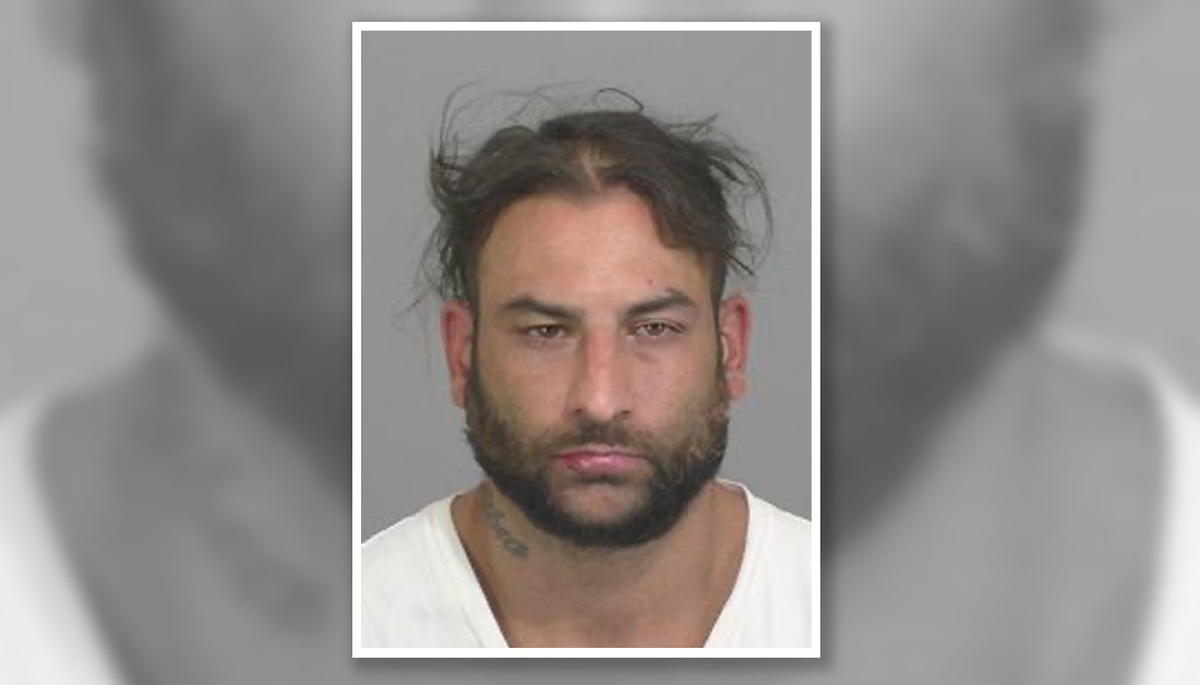 Police search for fugitive wanted on several charges