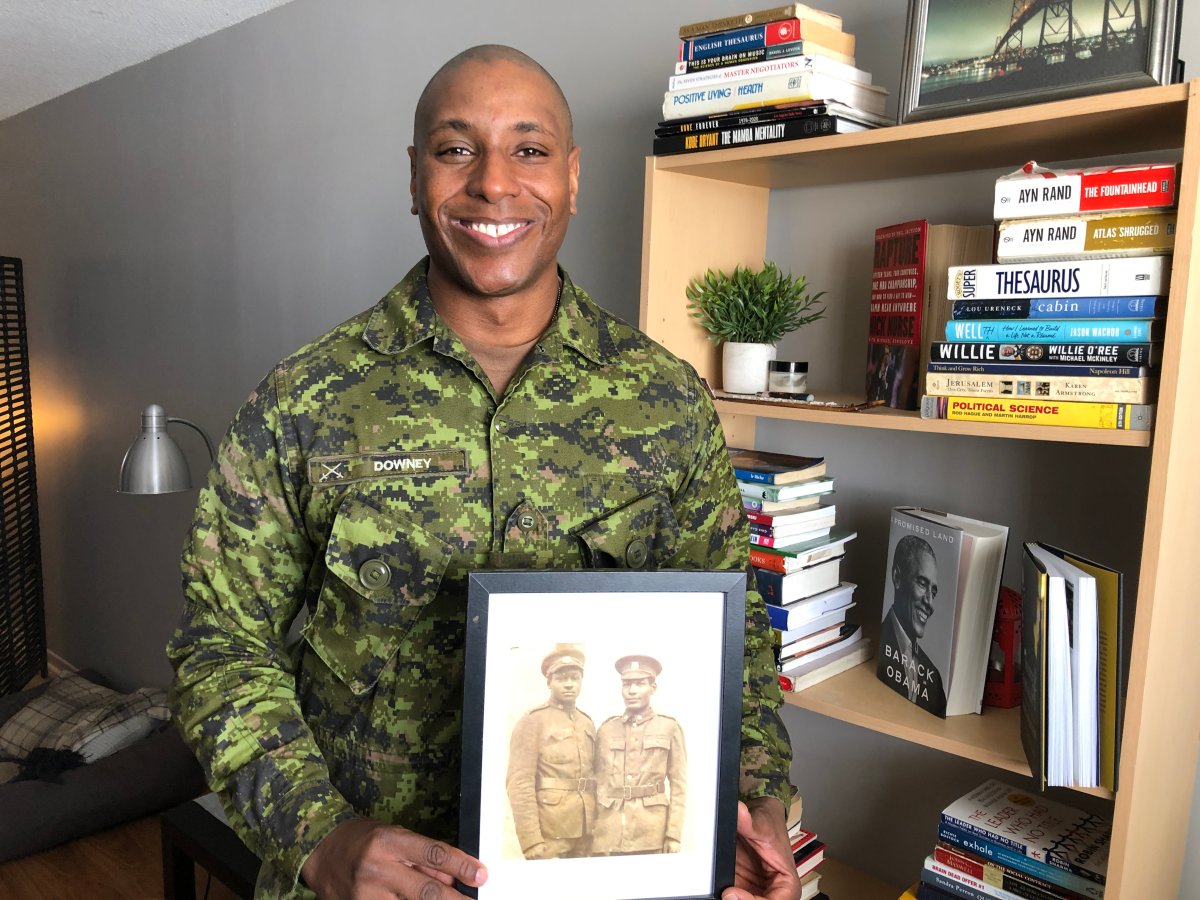 Army reservist 2Lt. Jerome Downey holds a picture of his great grandfather who was a soldier with the No. 2 Construction Battalion in the First World War.