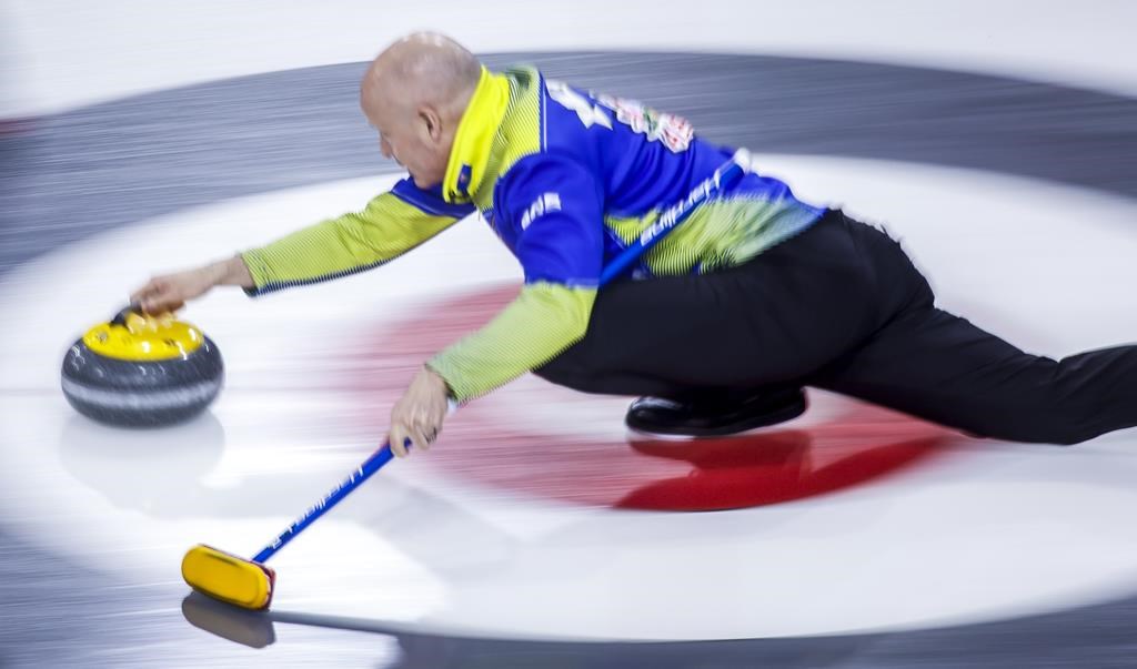 Team Alberta skip Kevin Koe makes a shot while playing Team Prince Edward Island at the Tim Hortons Brier in Lethbridge, Alta., Thursday, March 10, 2022.