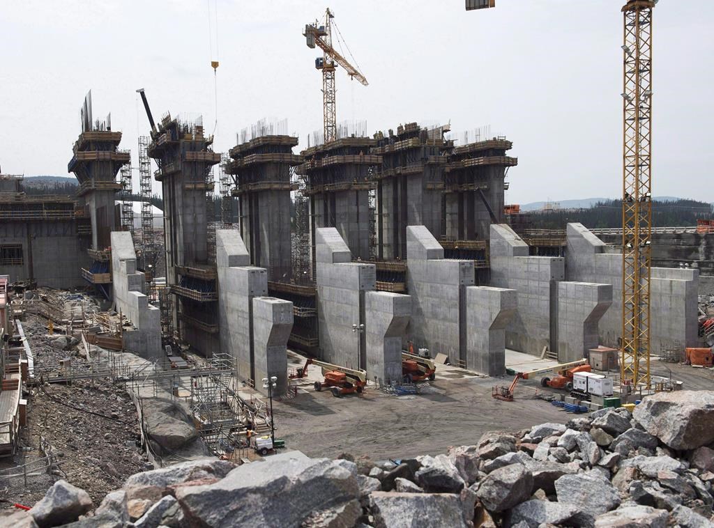 The construction site of the hydroelectric facility at Muskrat Falls, N.L., is seen on Tuesday, July 14, 2015. A consulting firm says it could be more than a year before Newfoundland and Labrador's beleaguered Muskrat Falls hydroelectricity project is producing at full commercial capacity. THE CANADIAN PRESS/Andrew Vaughan.