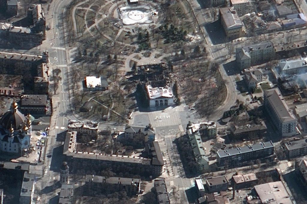 This satellite image provided by Maxar Technologies on Saturday, March 19, 2022 shows the aftermath of the airstrike on the Mariupol Drama theatre, Ukraine, and the area around it. (Satellite image ©2022 Maxar Technologies via AP)