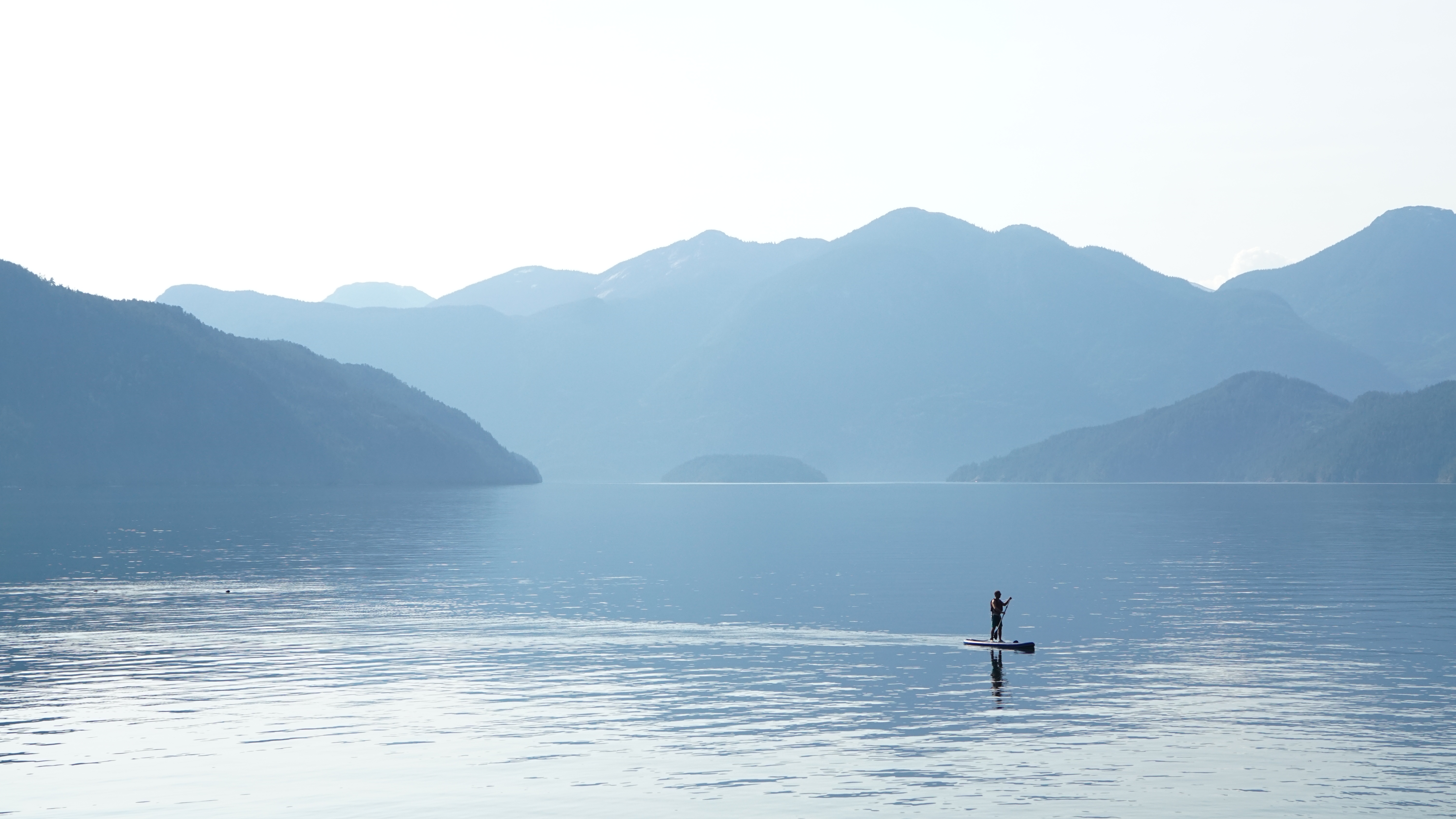 A standup paddleboarder in Desolation Sound, B.C., near the Klahoose Wilderness Resort.