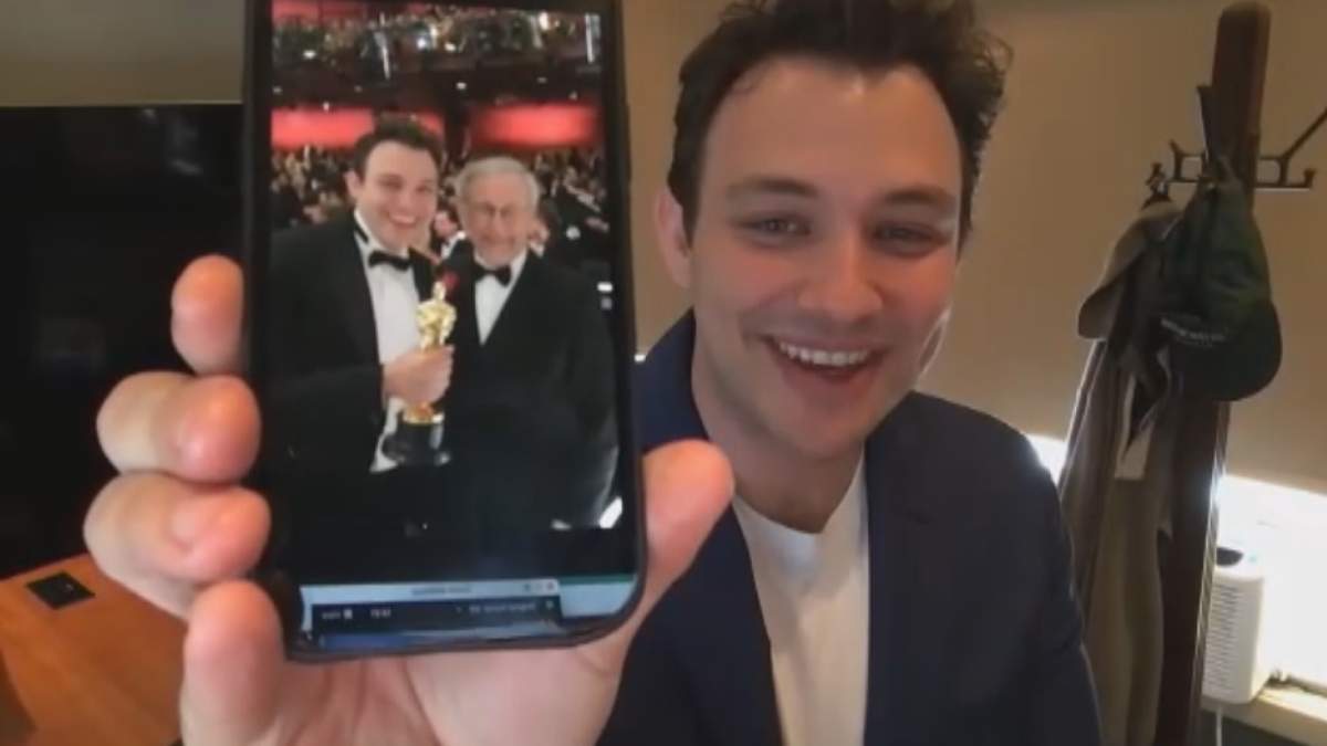 Oscar-winning director Ben Proudfoot shows off his photo with Steven Spielberg, taken at the Academy Awards.