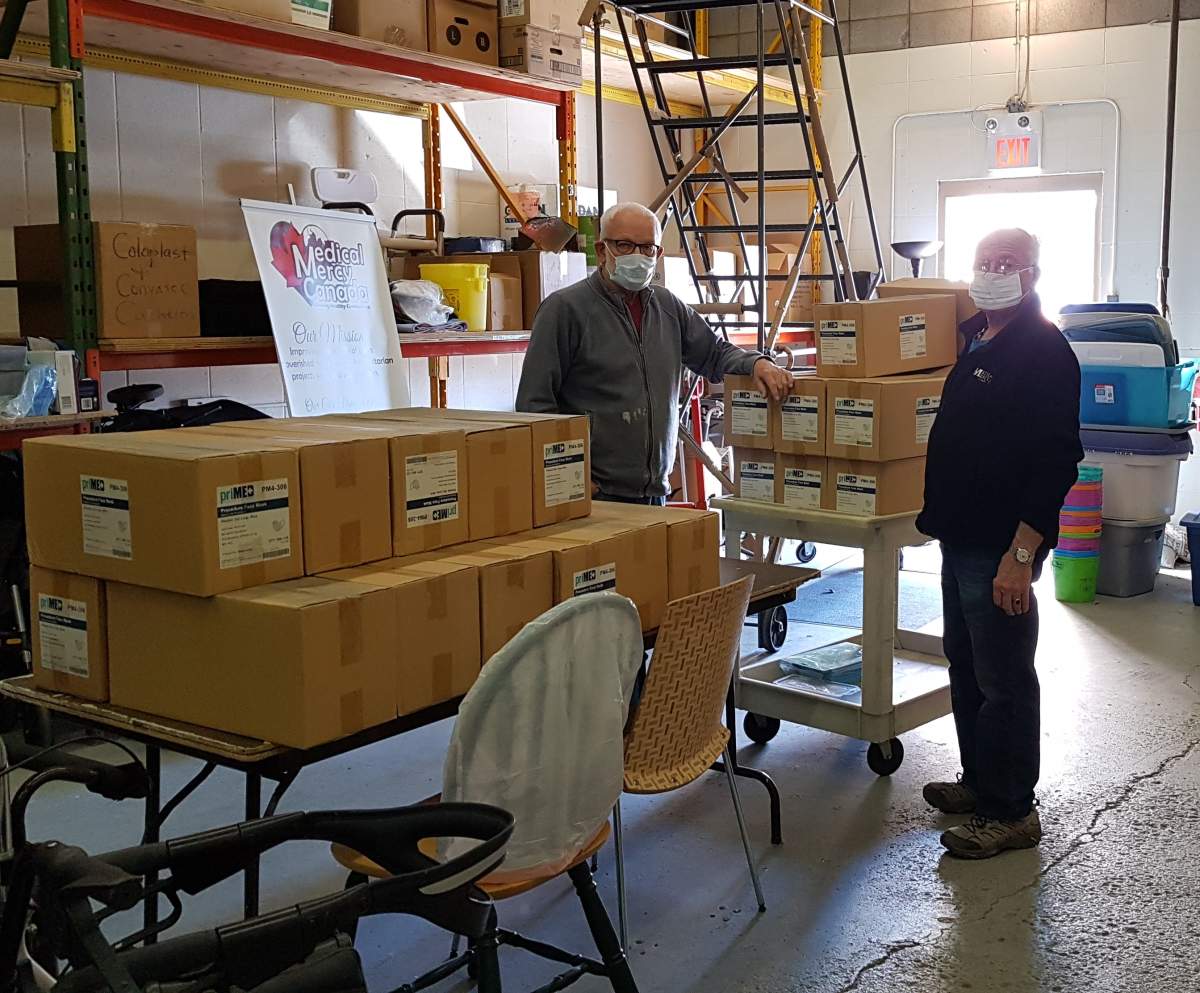 Workers at Medical Mercy Canada put together packages of medical supplies to ship to Ukraine.