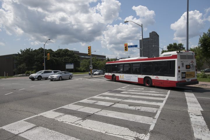 A TTC bus turns west.