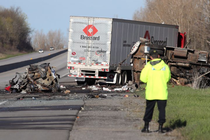 A reconstruction OPP officer attends the site of a crash in the westbound 401, northeast of Kingston, Ont. on Thursday May 11, 2017. 