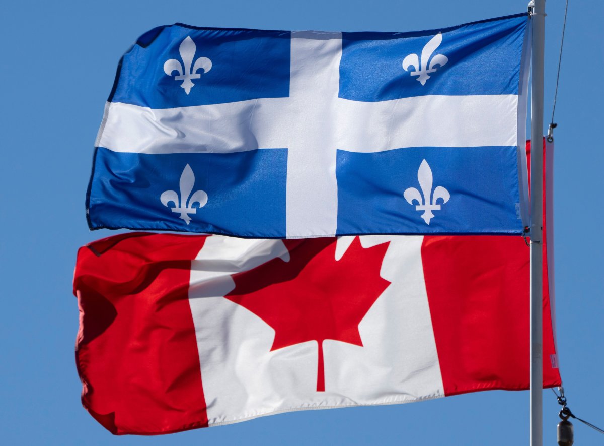 The Canadian and Quebec flags fly on Monday, November 1, 2021 in Gatineau, Quebec.