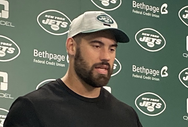 NFL football player Laurent Duvernay-Tardif, left, hugs his agent