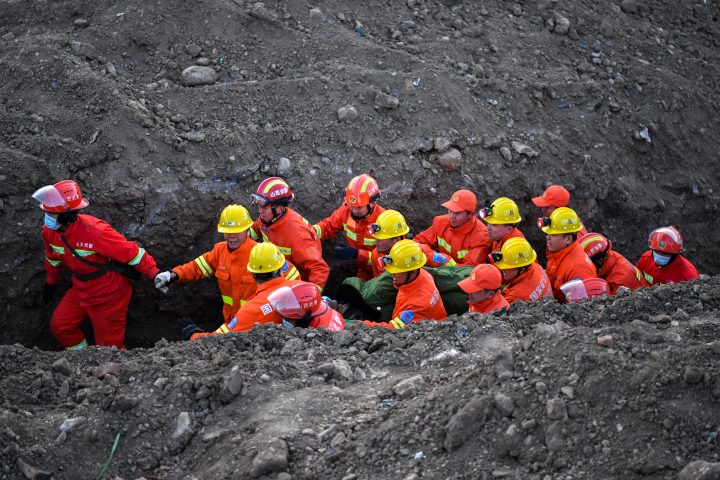 File - XIAOYI, Dec. 17, 2021  Rescuers work at the site of a flooded coal mine in Duxigou Village, Xiaoyi City, north China's Shanxi Province, Dec, 17, 2021. 