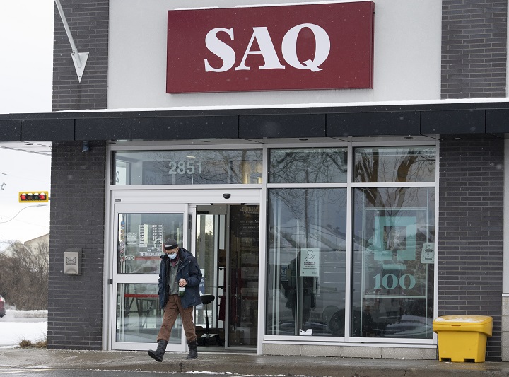 A customer leaves an SAQ outlet Thursday, January 6, 2022 in Deux-Montagnes, Que.